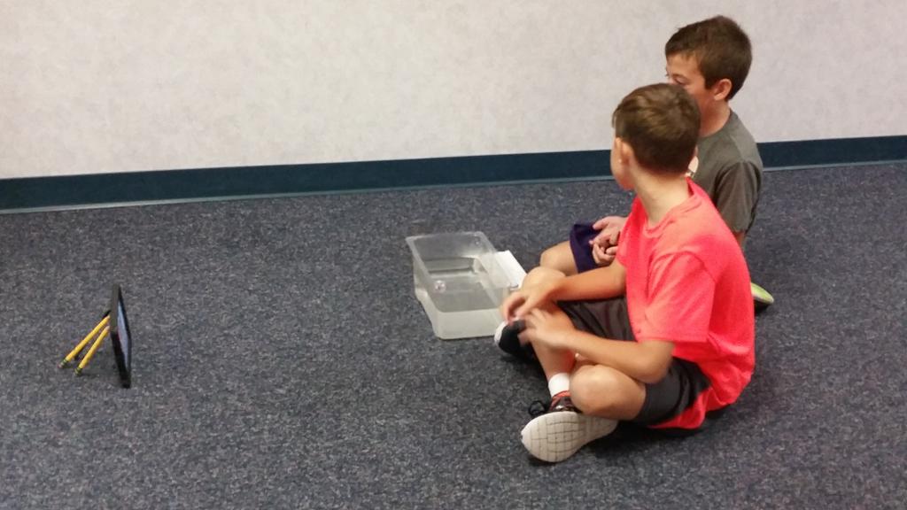 BerryMarion3's tweet photo. While filming density experiment, both boys wanted to be in the film. They used some creativity to prop up the iPad! http://t.co/95zVlJsVKm
