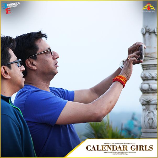 Caught in the act! What is <a href="/imbhandarkar/">Madhur Bhandarkar</a> clicking? Is it a #Selfie or a photo of the #CalendarGirls