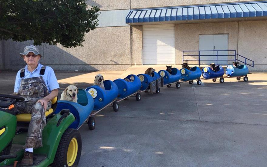 rubyandduke's tweet photo. This man is our hero, 80 year old Eugene builds a train for his strays http://t.co/gtbYs7Hf35 http://t.co/3LSOU6fjrz