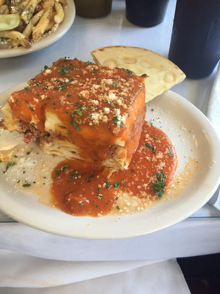 Traditional Greek Casserole w/eggplant, ground beef &amp; cheese. Topped w/bechemel sauce and baked w/homemade love.