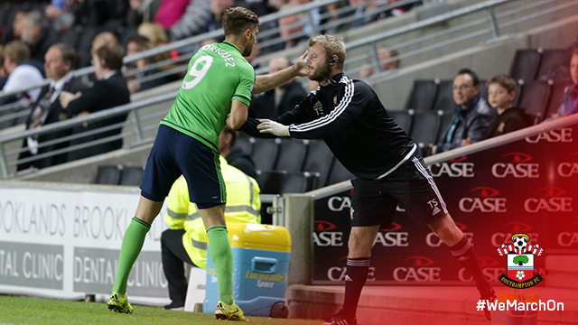 After opening the scoring for #SaintsFC, @JayRodriguez9 celebrates with physiotherapist Tom Sturdy.