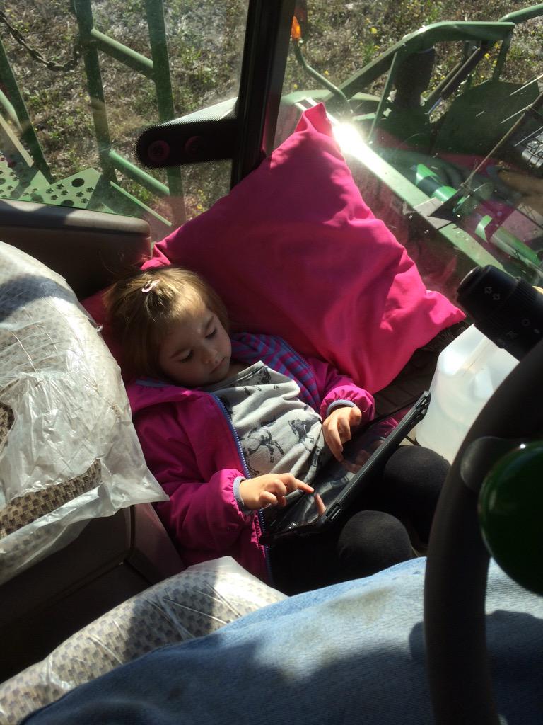 #WomenOfHarvest15 she's only 3, but she has this combining thing figured out, iPad and pillow included