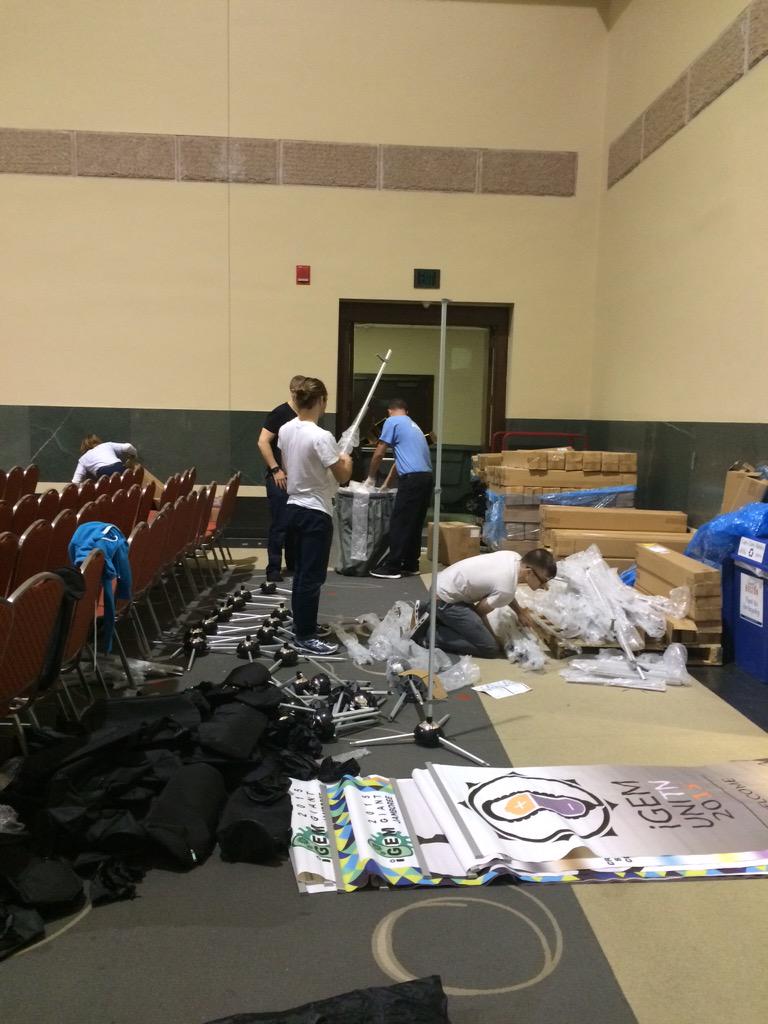 iGEM's tweet photo. Hard at work assembling team banners for #GiantJamboree! http://t.co/Hae9nK6Cuw