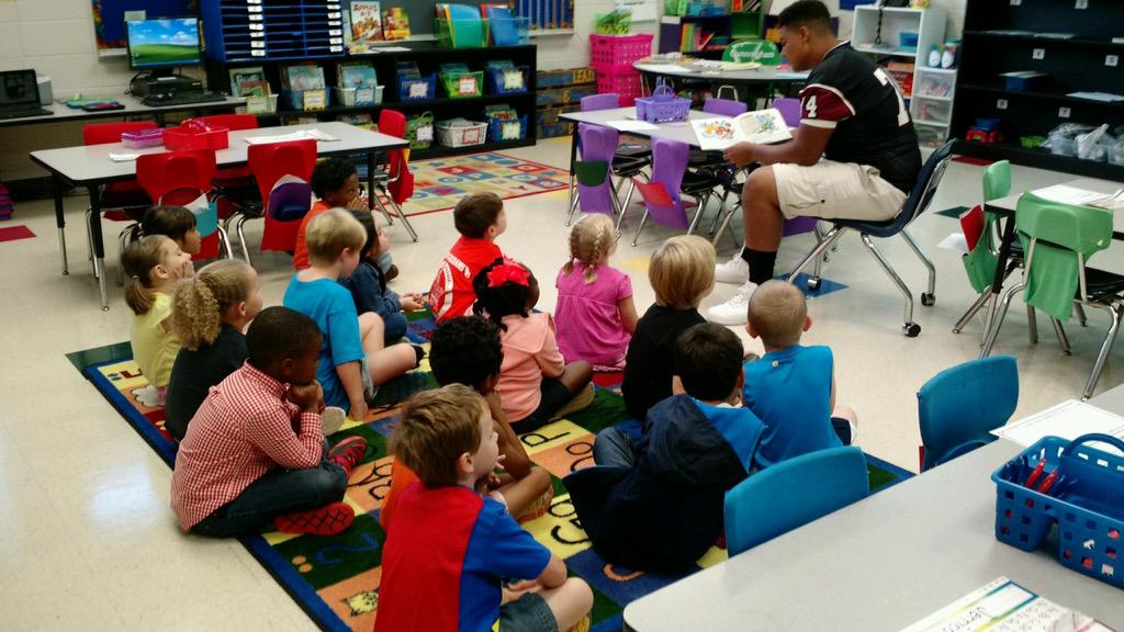 EmilyPScroggins's tweet photo. SHS football players reading to Mrs.cunningham 's class #SparkmanFamily http://t.co/yIe4gBf4Ey