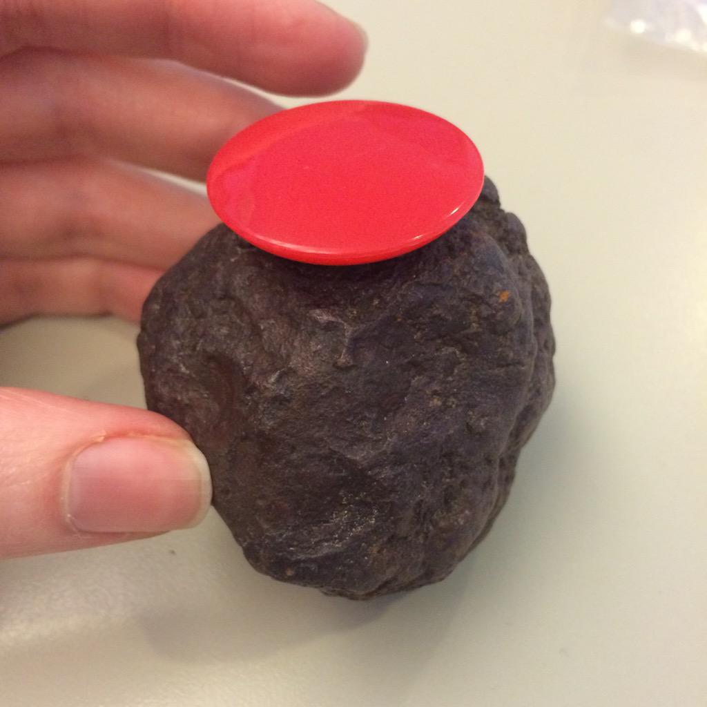 AskUsMV's tweet photo. A heavier-than-it-looks "rock", wearing a magnet (#nicehat), smooth edges. What do you reckon? #meteorite? #IDFriday http://t.co/qqQ9gk89kR