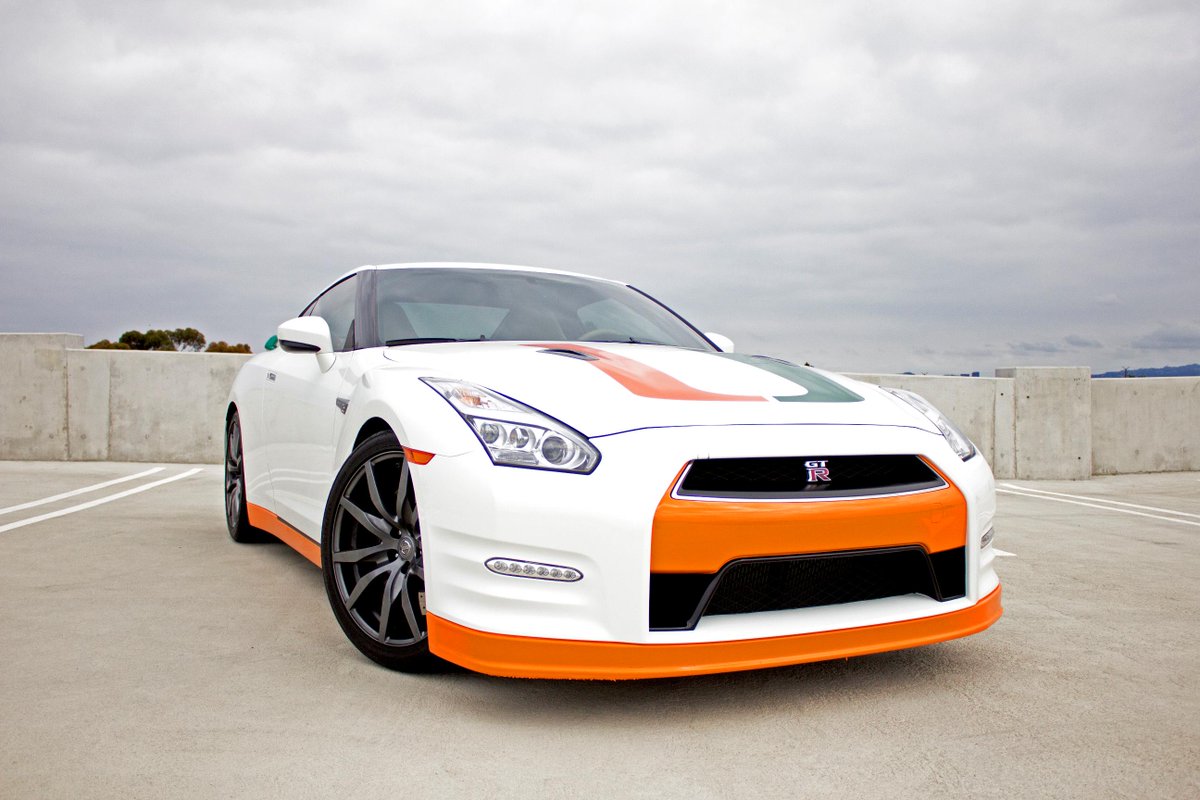 NissanUSA's tweet photo. The Nissan GT-R: Miami Hurricane edition. As driven by Vinny Testaverde. #MIAvsFSU #HeismanHouse http://t.co/QnliQVqIzh