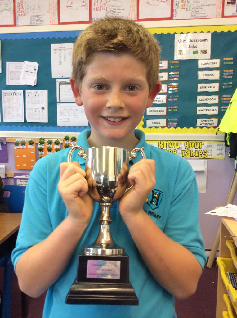 hiltoninverness's tweet photo. Charlie MacRae from P5M proudly displays the trophy won at the junior shinty championship! #hiltonpupilshaveit http://t.co/jdoe0RkE7w