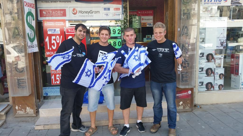 Ze_Adir's tweet photo. Today I gave out Israeli flags to pass byers. YEP, It was a good day. #strong_Israel #Blue_and_white http://t.co/SxuSjuH0vh
