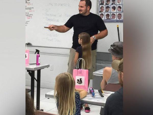 GMA's tweet photo. Single father starts a class to teach local fathers how to style their daughter's hair: http://t.co/mztMGWyDTX http://t.co/e9BiBtgNlQ