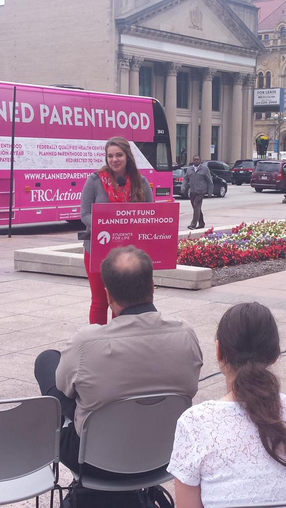 yplcentralohio's tweet photo. Maddy Buschar, President of the Pro Life Club at OSU addresses the crowd at @Students4LifeHQ #dontfundpp bus tour http://t.co/qcF3zQdFwf