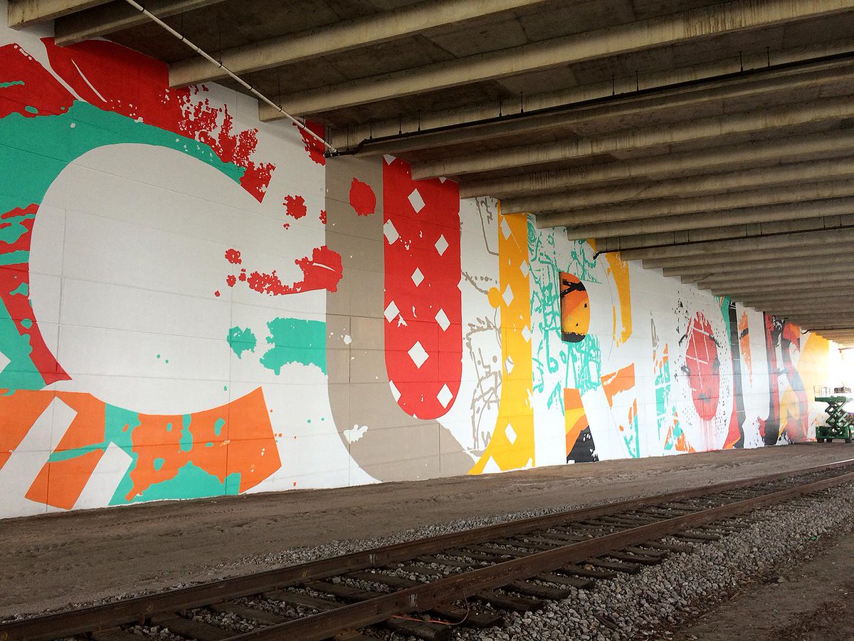 CityofTampa's tweet photo. Have you seen the Poe Parking Garage lately? Muralists Bask &amp; Tes One have been busy this week! #staycurious #Tampa http://t.co/YuVzlzY1wo