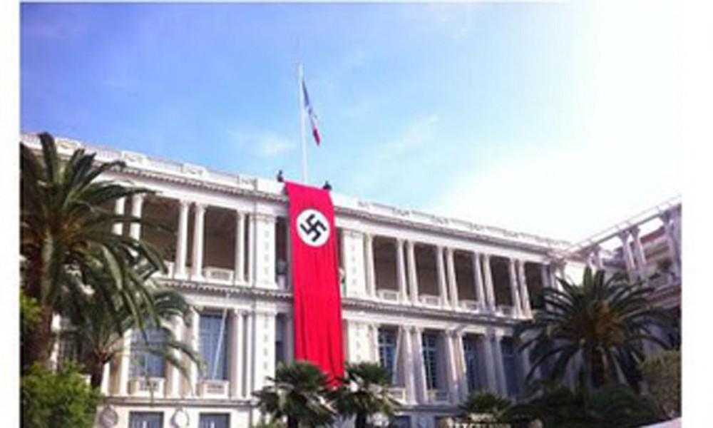 BFMTV's tweet photo. Nice: la préfecture arbore un drapeau nazi et doit s'expliquer http://t.co/eSQFkwDzFi http://t.co/AzwzgMSvVI