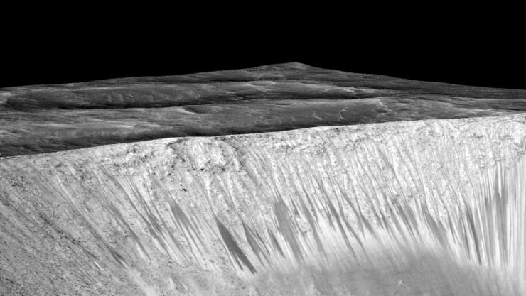PCMag's tweet image. Confirmed: There&apos;s Flowing Liquid Water on Mars bit.ly/1jqQyUk