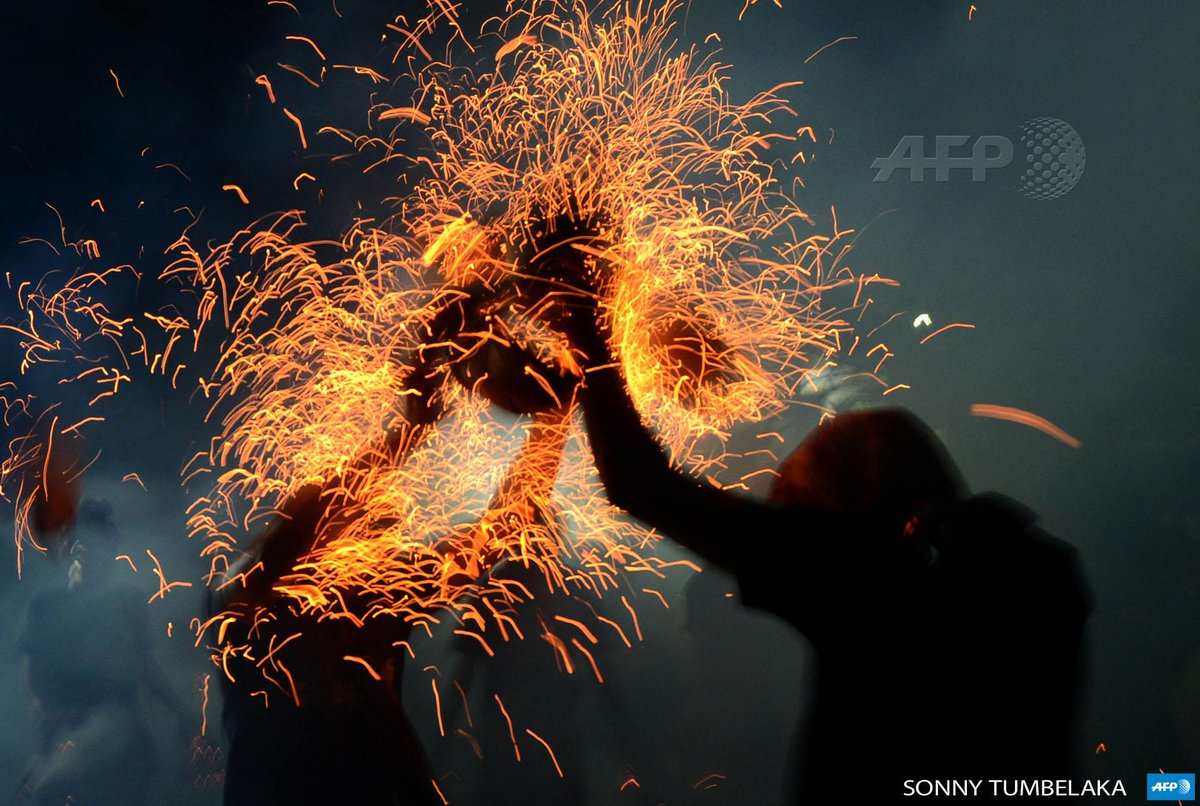 INDONESIA - Balinese youths participating in a fire war ceremony called Siat Geni  in Kuta. By <a href="/sonny_bali/">sonny Tumbelaka</a> #AFP
