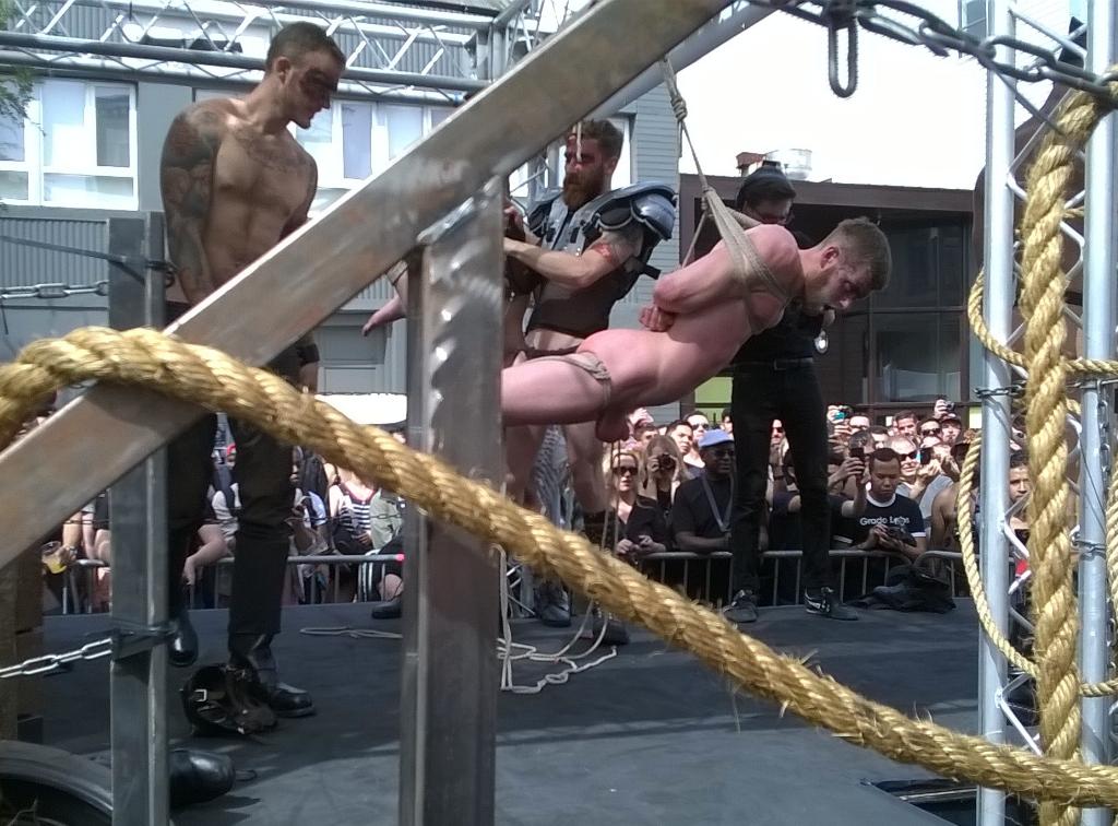 GaySneaker's tweet photo. "@Big_Daddy_SF: @christianwildex flogs @CassBoltonxxx @Folsom Fair exhibition http://t.co/8QWKepA9Eg"