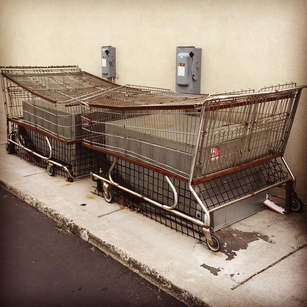 erinnstumpf's tweet image. Umm, yes I suppose that's one way to keep HVAC units secure. And repurpose old shopping carts. #antitheftdevice