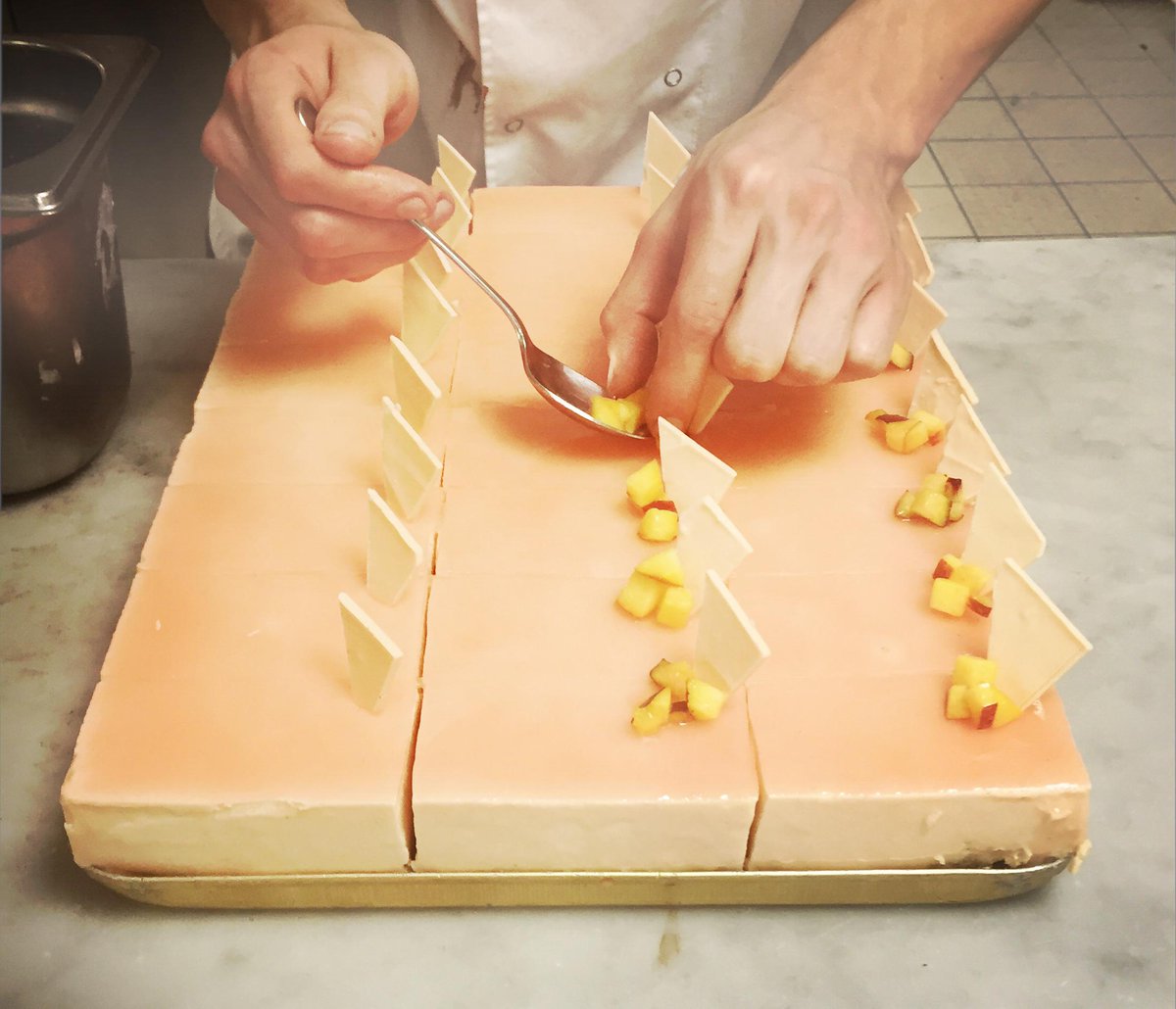 Princi_London's tweet photo. Infinitely Peach #Cake gets the final touches of peach &amp; white chocolate. #principasticceria #spiritodimilano http://t.co/0nZsaDx7lG