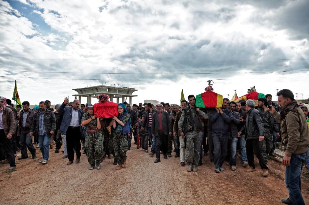 VICENews's tweet photo. In Photos: Grief, pride, and hope in the ruins of Kobane http://t.co/9xT3v7csIf http://t.co/wsYfs4Bumn