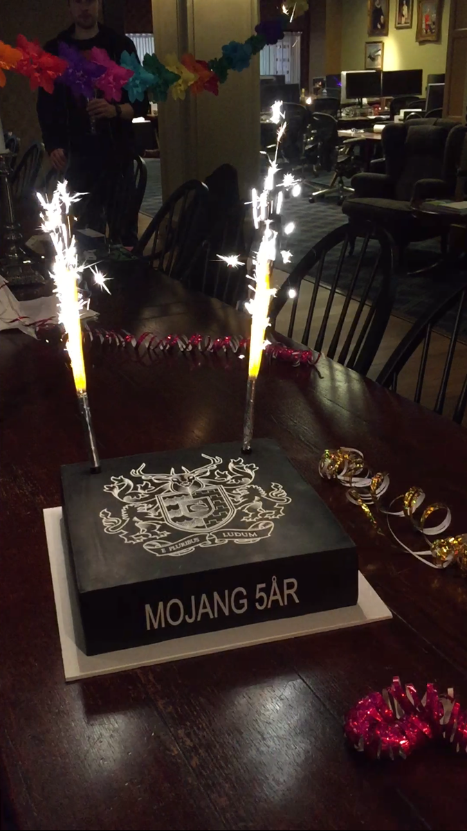 Minecraft's tweet image. Happy Birthday to us! Mojang is five years old today. Check out our classy cake featuring the official Mojang crest!
