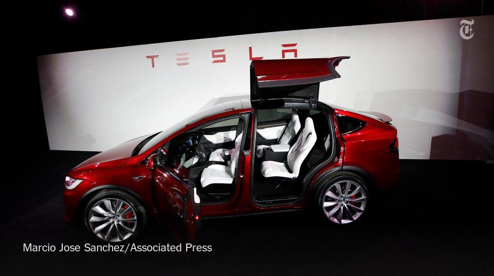 nytimes's tweet photo. Tesla delivers Model X, its first SUV http://t.co/fxBeFPAC7g http://t.co/7qIMz24VYM