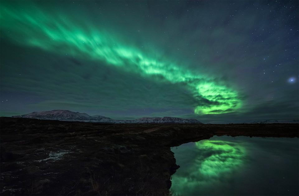 Aurora Borealis Behind Clouds | Photography by ©Friðþjófur M.