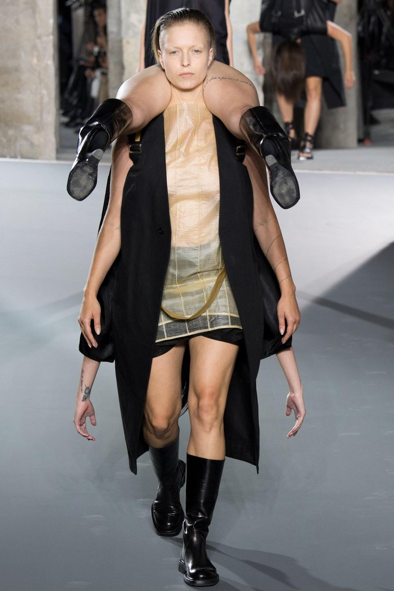 Models carried their colleagues upside down on the catwalk ...