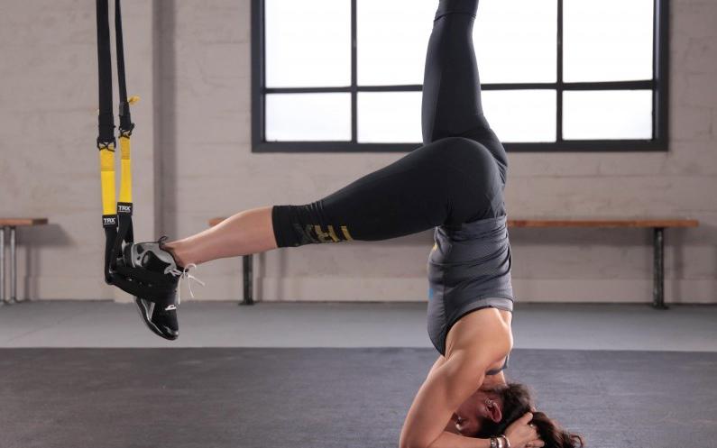 Want to conquer the elusive headstand? <a href="/shauna_harrison/">Dr. Shauna Harrison</a> explains how to master it with #TRX! bit.ly/1KI4MqI
