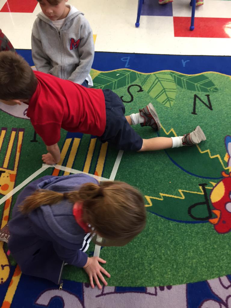 stmkindergarten's tweet photo. KB started creating a Halloween themed maze for our robot, Dash! First step...create the path! #STEAM @stmsaints http://t.co/JIM79fR5Ah
