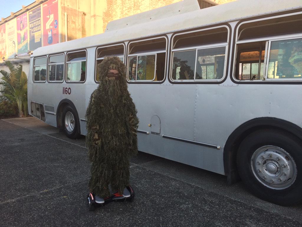 actreacttheatre's tweet image. #Rollmo commando camouflage dude in front of our bus. “Just changing the world”.