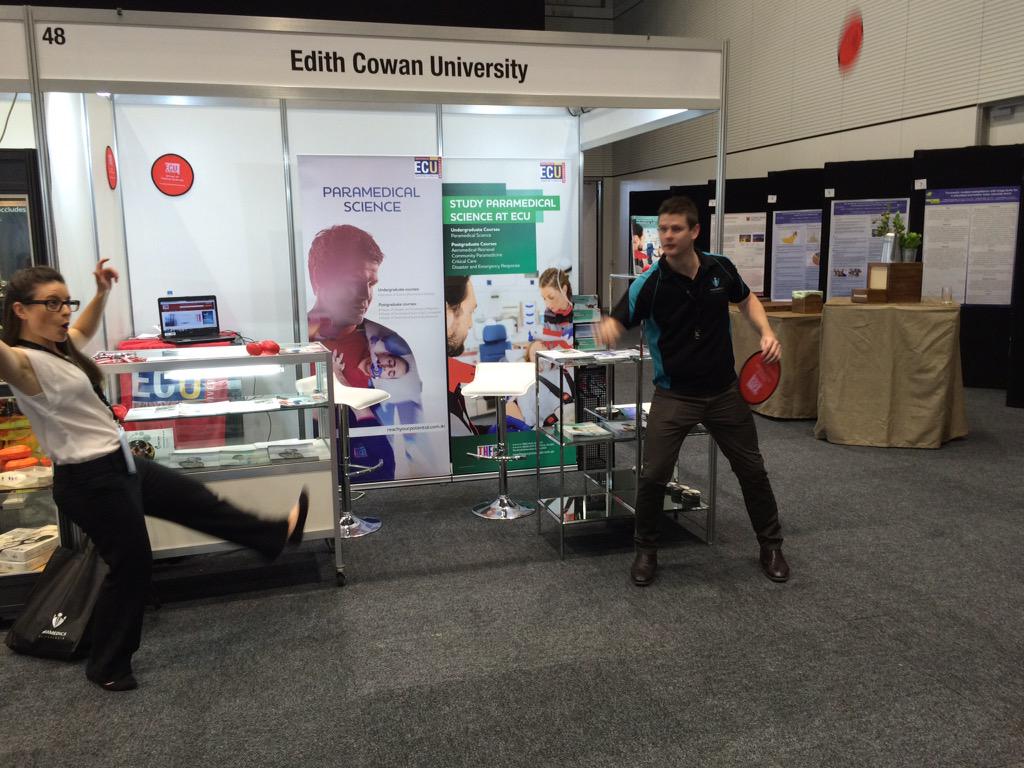 AustraliaEMS's tweet photo. Serious frisbee throwing contest at the @EdithCowanUni stand. @54Brea has some hidden talents! #PAIC2015 http://t.co/u2YMDmJCUf