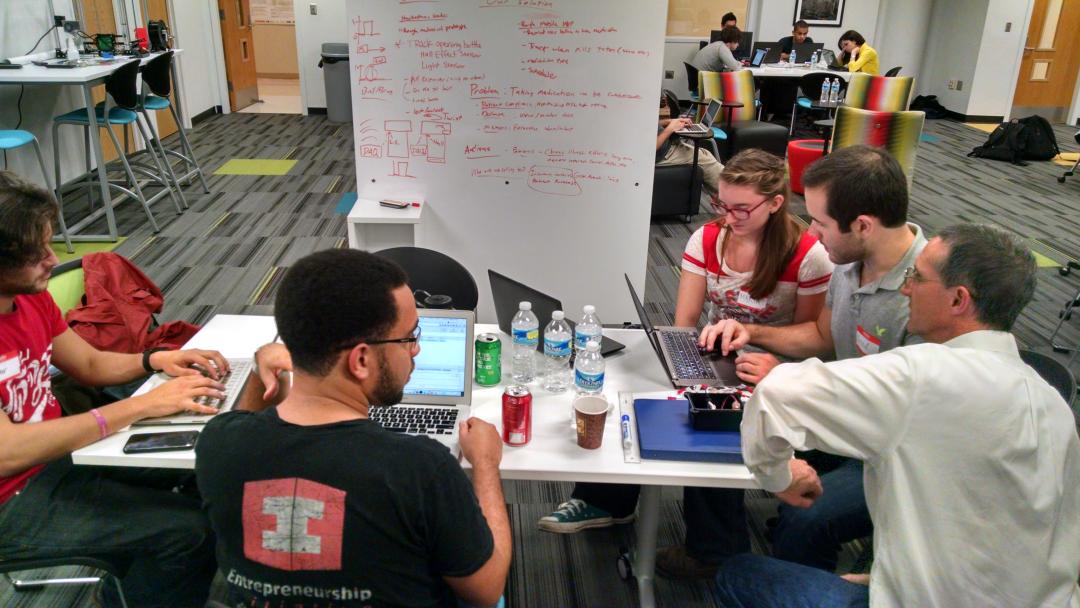 DSInc_Cellio's tweet photo. Chris Lamb with hacking team. #ncriothack @ASSISTCenter @NCRIoT @bright_wolf #cellio #hackathoniotnc #iot #m2m http://t.co/cXJgZ90dRP