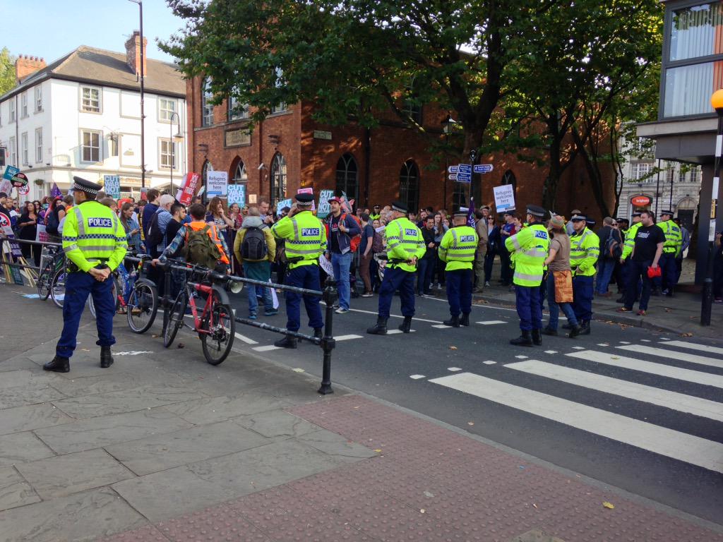 adamsmith0904's tweet photo. @bbcradiomanc police holding protester line due to lack of space at the venue. http://t.co/RtZUYMaa5k