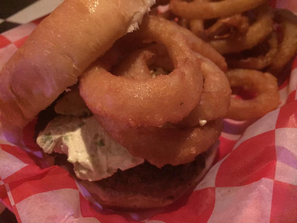 Our Jalapeño Popper burger is covered in jalapeño cream cheese &amp; topped with onion rings. Spicy &amp; tasty! #Detroit