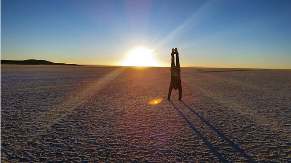 FlightCentreCa's tweet photo. Our very own flightie, Brent P, #chasingsunrise at the Uyuni Salt Flats in #Bolivia.  #flightielife #traveltuesday http://t.co/ClxsB3HEmP