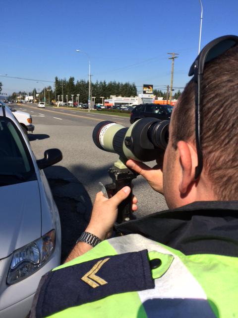 SurreyRCMP's tweet photo. Think we can’t see you checking that text message? We’re scoping for distracted drivers. http://t.co/p7FqPolrHN