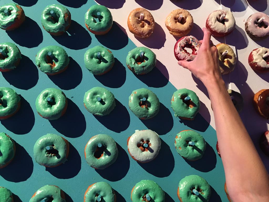 workgroupsdv's tweet image. Yes, that&apos;s a wall entirely of doughnuts. #AdobeMAX #MAXbash