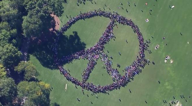 pitchfork's tweet photo. .@yokoono celebrated @johnlennon's 75th birthday by organizing a giant human peace sign http://t.co/xj3uWmJSUw http://t.co/YBQ2tSFbAF