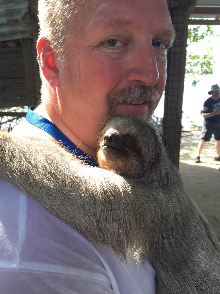 zoe_elizabeth3's tweet photo. yup. my dad is getting hugged by a sloth in Belize #fallbreakgoals http://t.co/EVd7uTgmtu