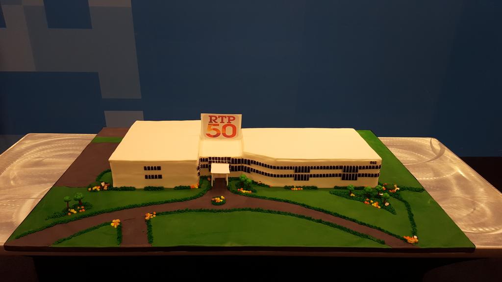 TimothyHumphrey's tweet photo. IBM RTP celebrates 50 years with this lovely cake and poster ceremony #RTP50 #IBMRTPCares http://t.co/tNWW28yGJJ