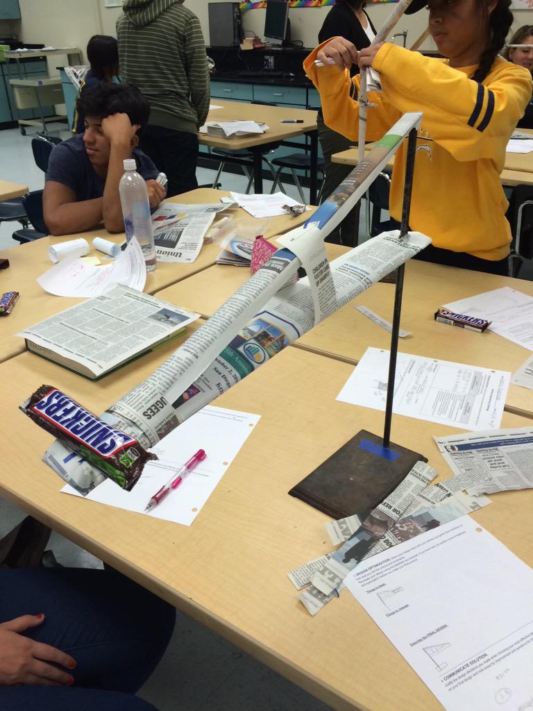 cmarilyn14's tweet image. we designed a solution for suspending a snickers bar using news paper and tape #ehsphysics @janae_sisler