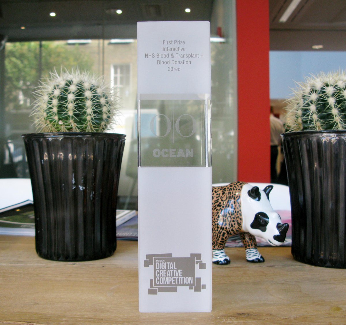 23red's tweet image. We have happy creatives today with our @OceanOutdoorUK award for @GiveBloodNHS, here's a picture of our shiny award!