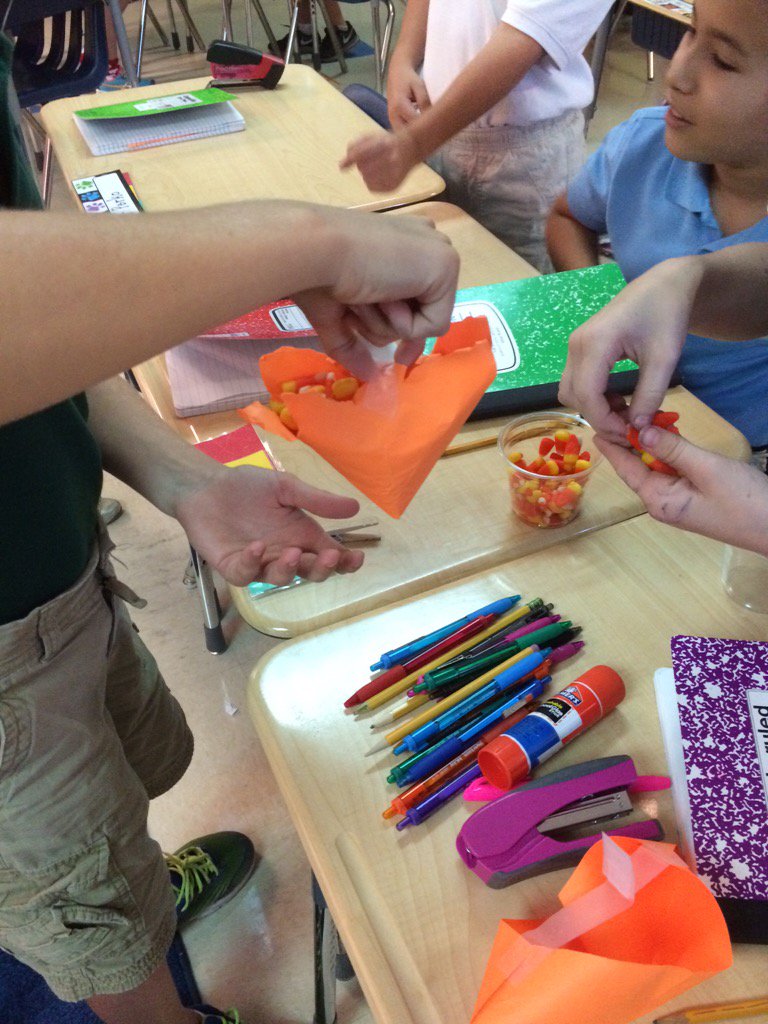 Mrs. Whelan's class engineering a basket to hold candy corn! JTES Tigers Rock!