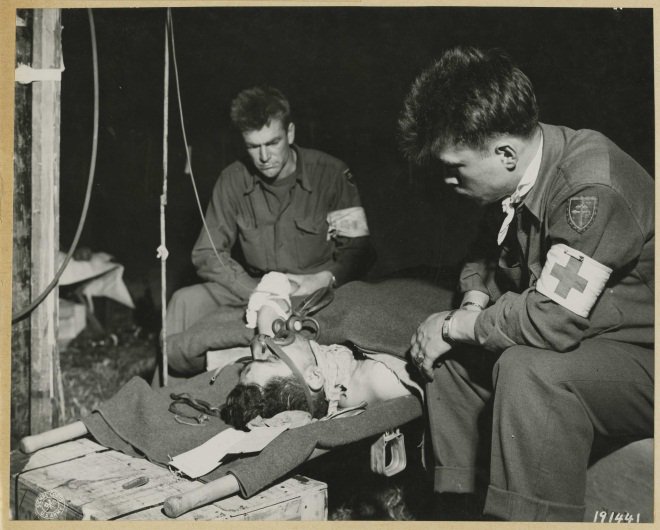 MilitaryHealth's tweet image. #TBT: A wounded soldier receives blood plasma &amp;amp; oxygen by the 304th Medical Battalion Infantry Division, 1944.
