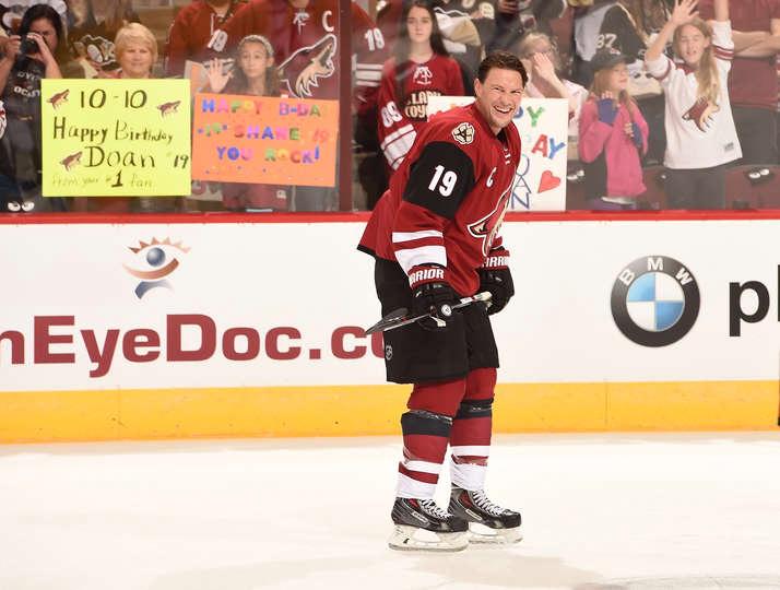 Shane Doan smiles as he skates past fans holding up sign wishing him a happy birthday during warmups 