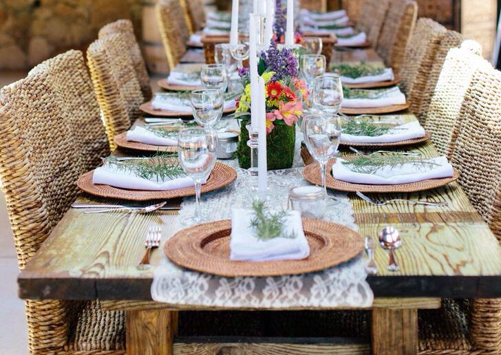 It's all in the details! Round rattan charger plates + rosemary= table-setting perfection