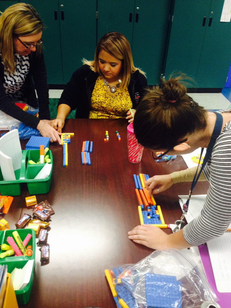 Fourth grader teachers are using manipulatives to model division #sisdcoaches