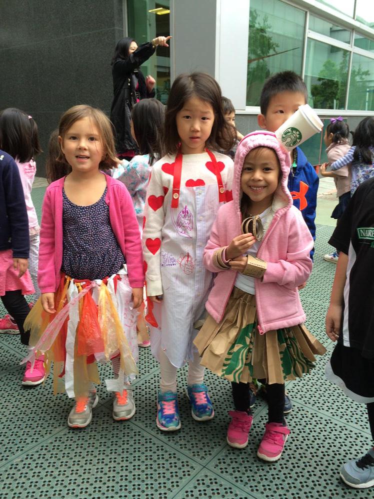 Kindergarten girls showing global mindedness and wearing recycled fashion for spirit week #learnisb