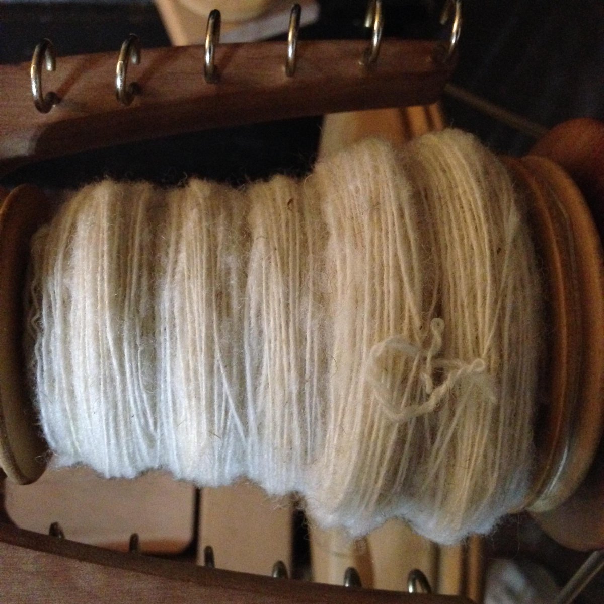 RCozyKnits's tweet photo. I spun a whole spool yesterday.  I keep falling... #wool #calred #handspinning #headcold  http://t.co/4fL0jJegis http://t.co/p4r7iNxSvw