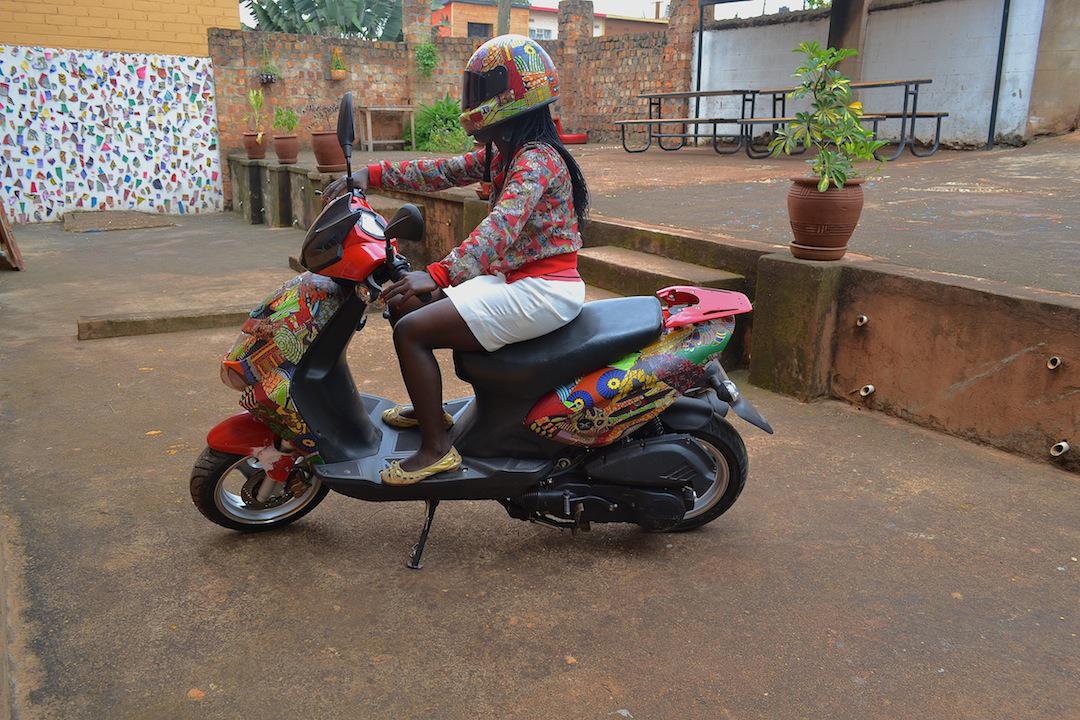 CollinSekajugo's tweet photo. This girl wanted her lifestyle revamped ASAP and we got her hooked. A pimped Hartford scooter plus a #Secolli helmet! http://t.co/0s8ZkYp9js