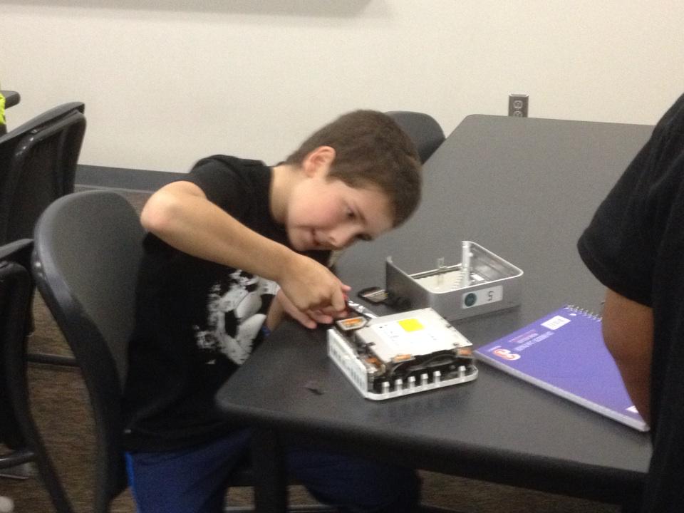 clayryoung's tweet image. Kickoff party in the take apart station. Discoveries within hard drives. #smsmakerspace